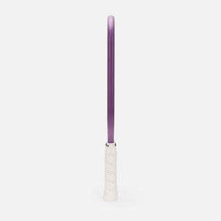 Purple and white pickleball paddle on a light gray background