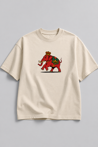 Beige t-shirt with a colorful elephant graphic on a gray background